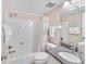 Clean bathroom with shower/tub combo, granite vanity, and updated fixtures at 5968 Midnight Pass Rd # 161, Sarasota, FL 34242