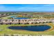 Luxury community with lake, golf course, and various housing styles at 6035 Worsham Ln # 104, Lakewood Ranch, FL 34211