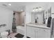 Clean bathroom with granite countertop, white cabinets, and bathtub at 6035 Worsham Ln # 104, Lakewood Ranch, FL 34211
