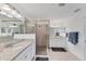 Spa-like bathroom featuring double vanities, granite countertops, and a shower at 6035 Worsham Ln # 104, Bradenton, FL 34211