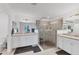 Elegant bathroom with double sinks, granite counters, and a large walk-in shower at 6035 Worsham Ln # 104, Lakewood Ranch, FL 34211