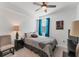 Comfortable bedroom with a queen-size bed, nightstand, and ceiling fan at 6035 Worsham Ln # 104, Lakewood Ranch, FL 34211