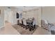 Bright dining room with a dark wood table and six chairs at 6035 Worsham Ln # 104, Lakewood Ranch, FL 34211