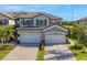 Two-story house with two-car garage, and nicely landscaped lawn at 6035 Worsham Ln # 104, Lakewood Ranch, FL 34211