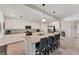 Modern kitchen featuring granite island and white cabinetry at 6035 Worsham Ln # 104, Bradenton, FL 34211