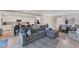 Open kitchen with island, white cabinets and stainless steel appliances at 6035 Worsham Ln # 104, Lakewood Ranch, FL 34211