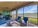 Spacious screened lanai with water views and comfortable seating at 6035 Worsham Ln # 104, Lakewood Ranch, FL 34211