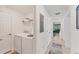 Convenient laundry room with washer, dryer, and extra shelving at 6035 Worsham Ln # 104, Lakewood Ranch, FL 34211