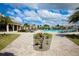 Relaxing resort-style pool with lounge chairs and landscaping at 6035 Worsham Ln # 104, Lakewood Ranch, FL 34211