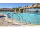 Inviting resort-style pool with a waterfall feature at 6035 Worsham Ln # 104, Lakewood Ranch, FL 34211