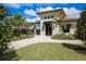 Exterior view of community tennis clubhouse at 6035 Worsham Ln # 104, Lakewood Ranch, FL 34211