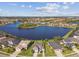 An aerial view showcasing the house's location within a peaceful, lakeside community at 6227 Anise Dr, Sarasota, FL 34238