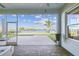 Screened porch with paver patio and lake views at 6227 Anise Dr, Sarasota, FL 34238