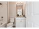 Clean and bright bathroom featuring white vanity, toilet, and bathtub at 6227 Anise Dr, Sarasota, FL 34238