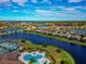 Aerial view showing the property's location in a waterfront community with pool and tennis at 6720 Wild Lake Ter, Bradenton, FL 34212