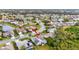 Aerial view of a house with a pool in a residential area at 6880 Corral Cir, Sarasota, FL 34243