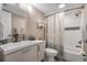 Clean bathroom with a tub shower combo and updated vanity at 7205 Curtiss Ave # 2E, Sarasota, FL 34231