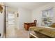 Bedroom with a daybed, built-in shelving, and access to kitchen at 759 N Jefferson Ave # 759, Sarasota, FL 34237