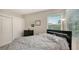 Bedroom with a queen-size bed, dresser, and large closet at 8956 Huntington Pointe Dr, Sarasota, FL 34238