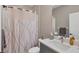 Modern bathroom with shower/tub combo, single vanity, and contemporary fixtures at 11265 Mc Dermott Ct, Englewood, FL 34223