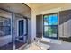 Inviting front entryway with a screened door and decorative shutters at 11265 Mc Dermott Ct, Englewood, FL 34223