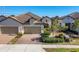 Attractive home with tile roof, paver driveway, and landscaped yard at 11265 Mc Dermott Ct, Englewood, FL 34223
