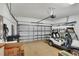 Spacious garage with storage, a golf cart, and an EV charger at 11265 Mc Dermott Ct, Englewood, FL 34223