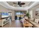 Comfortable living area with sliding glass door to patio and serene water views at 11265 Mc Dermott Ct, Englewood, FL 34223