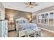 Serene Primary bedroom with a king-size bed, tasteful decor, and natural light at 11265 Mc Dermott Ct, Englewood, FL 34223