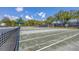 Empty tennis court ready for a match at 11265 Mc Dermott Ct, Englewood, FL 34223