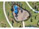 Overhead view of a playground with swings and shade structures at 15135 Sunny Day Dr, Bradenton, FL 34211