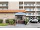 Welcoming building entrance with striped awning and landscaping at 1650 1St W Ave # 302B, Bradenton, FL 34205