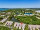 An aerial view highlighting the property's location within a lush, green community at 1720 Starling Dr # 103, Sarasota, FL 34231