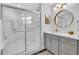 Bright bathroom featuring a glass shower, modern vanity, and stylish fixtures at 1720 Starling Dr # 103, Sarasota, FL 34231