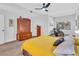 Spacious bedroom with large windows, a cozy sitting area, and a wooden armoire at 1720 Starling Dr # 103, Sarasota, FL 34231