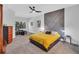 Modern bedroom with a unique accent wall, comfortable bed, and a cozy sitting area at 1720 Starling Dr # 103, Sarasota, FL 34231