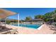 Large community pool with ample seating and shade at 1720 Starling Dr # 103, Sarasota, FL 34231