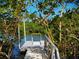 Private dock amidst lush mangroves, perfect for kayaking and enjoying the serene waterfront at 1720 Starling Dr # 103, Sarasota, FL 34231