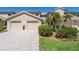 Attractive two-story townhome with a two-car garage and landscaped front yard at 1720 Starling Dr # 103, Sarasota, FL 34231