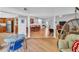 View of the living, dining, and kitchen areas from a unique vantage point at 1720 Starling Dr # 103, Sarasota, FL 34231