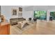 Living area with a plush sofa, stylish chairs, and access to the patio at 1720 Starling Dr # 103, Sarasota, FL 34231