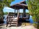 Charming waterfront gazebo, ideal for relaxation and enjoying the scenic views at 1720 Starling Dr # 103, Sarasota, FL 34231