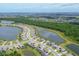 Aerial view of a luxury community with lakes and houses at 17507 Polo Trl, Bradenton, FL 34211