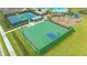 Overhead view of the community basketball court with green perimeter and blue accent paint at 17744 Savory Mist Cir, Bradenton, FL 34211