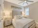 Bright bedroom with a comfy bed, decorative pillows, and modern nightstands at 17744 Savory Mist Cir, Bradenton, FL 34211