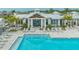Large community pool surrounded by lounge chairs and a spacious deck area at 17744 Savory Mist Cir, Bradenton, FL 34211