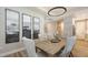 Comfortable dining area with modern wall art, stylish decor, and easy access to the nearby kitchen at 17744 Savory Mist Cir, Bradenton, FL 34211