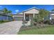 Charming single-story home with a well-manicured lawn, paver driveway, and attached two-car garage at 17744 Savory Mist Cir, Bradenton, FL 34211