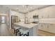 Well-equipped kitchen with modern appliances, a center island, and a clean design ideal for cooking and entertaining at 17744 Savory Mist Cir, Bradenton, FL 34211