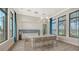 Elegant kitchenette area with modern appliances, a large island, and barstool seating at 17744 Savory Mist Cir, Bradenton, FL 34211